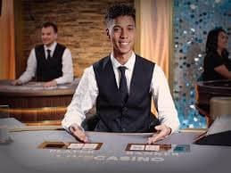 Dragon Tiger card reveal on ini188 login live-dealer table with instant settlement